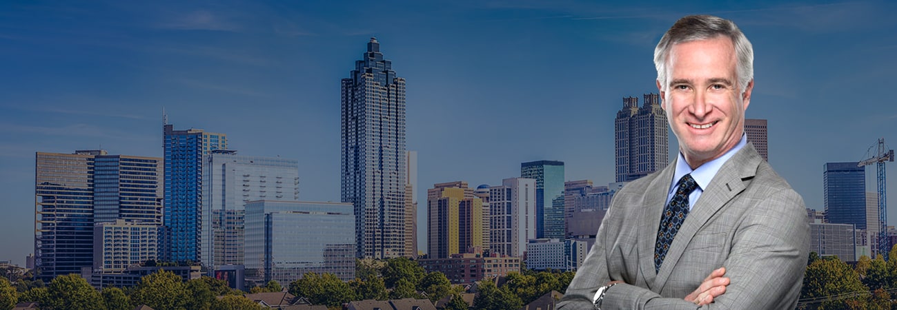 Hero Banner - Attorney Picture over skyline of Atlanta